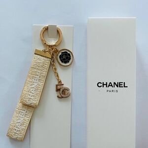 CHANEL Paris Gold-Tone Key Holder with Beige Ribbon and Camellia Charm